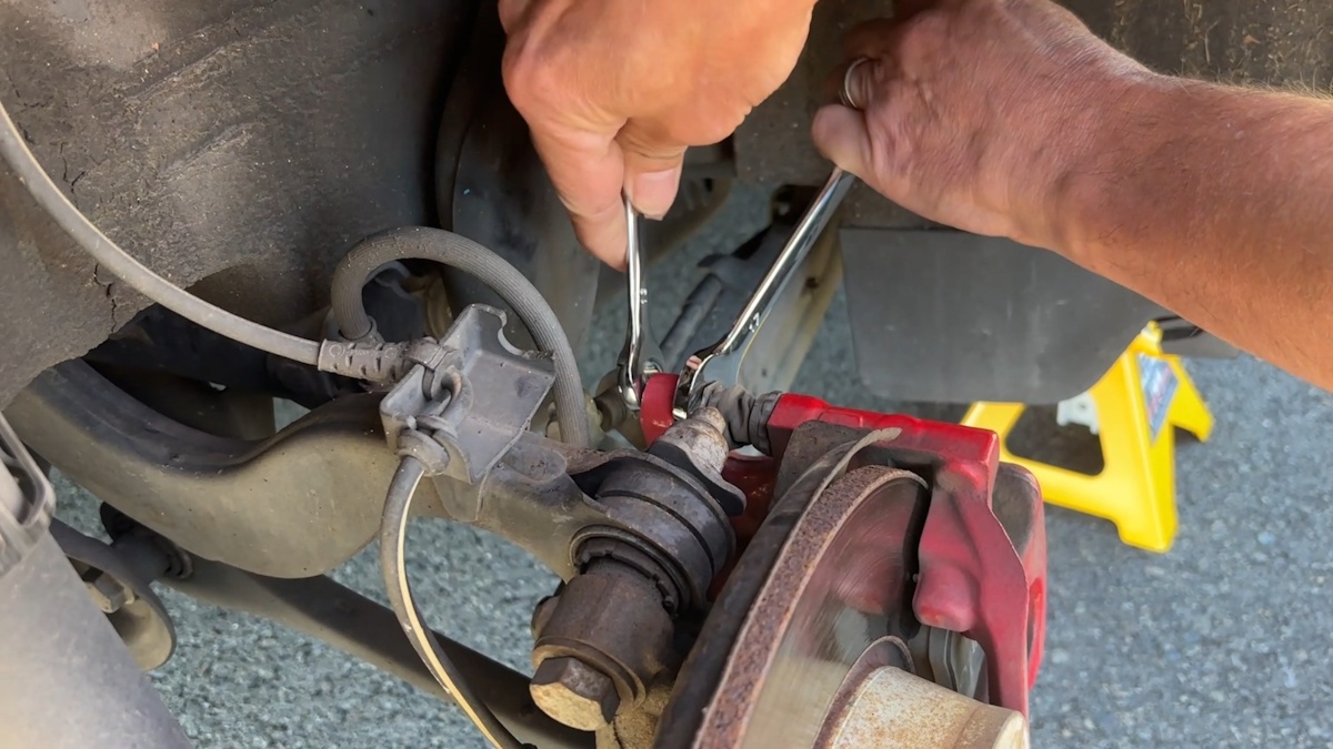 Removed wheel exposing rear caliper and rotor