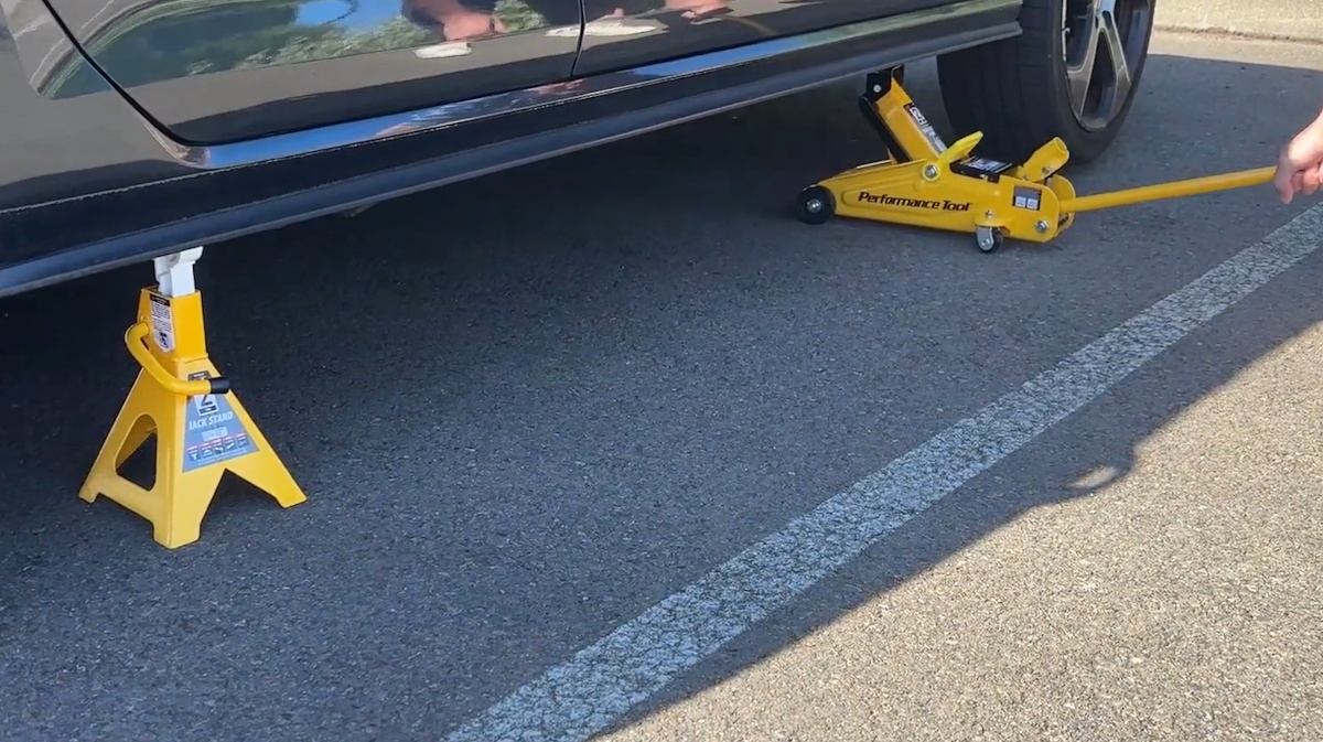 Raise the vehicle and support it securely with jack stands Vehicle safely supported with a floor jack and jack stands