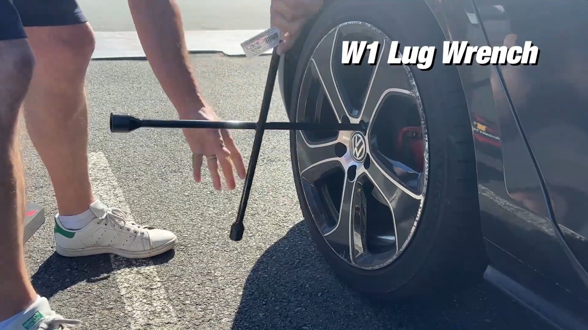 Loosen the wheel lug nuts before raising the vehicle Loosening wheel lug nuts with a lug wrench before lifting the vehicle