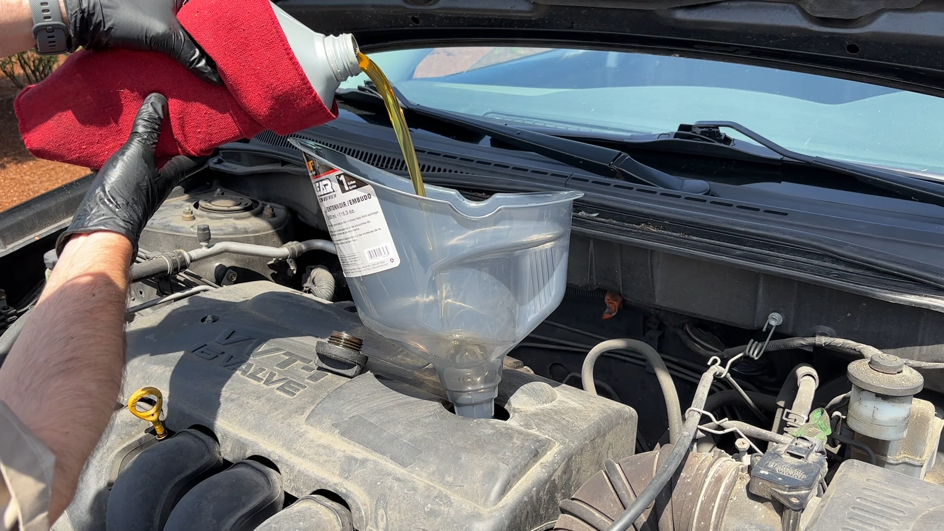 Remove the oil cap from the engine, and add new oil until the oil registers on the dipstick.