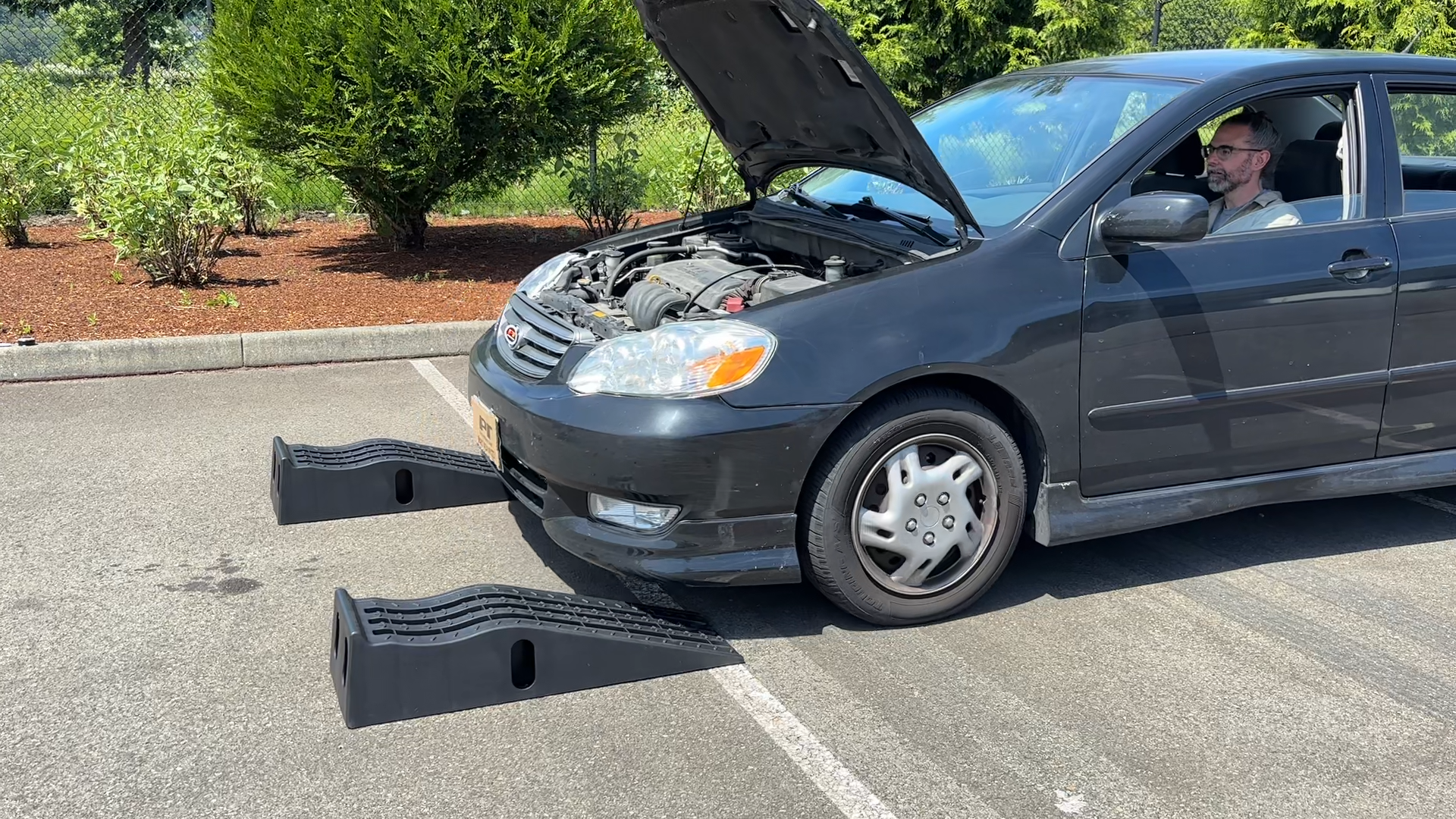 Roll the vehicle off the ramps slowly.